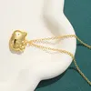 Sanrio Hello Kitty Gold Halskette – süßer Schleifen-Charm-Anhänger, Kawaii-Spielzeug für Mädchen und Frauen, elegante Geschenke