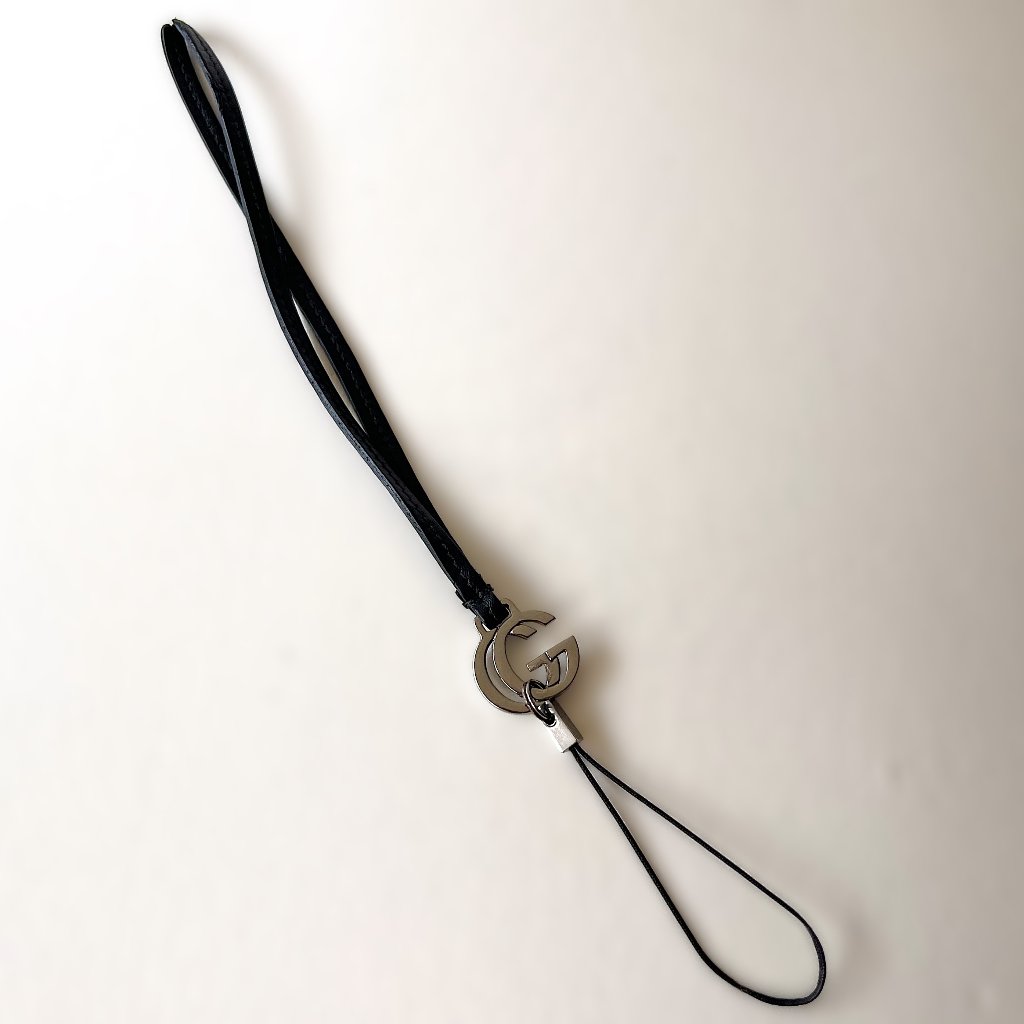 Gucci Cell Phones & Accessories | Authentic Gucci Black Leather Cell Phone Strap With Metal Gg Logo | Color: Black | Size: Os
