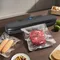 La piccola macchina per sottovuoto completamente automatica per uso domestico, la macchina per l