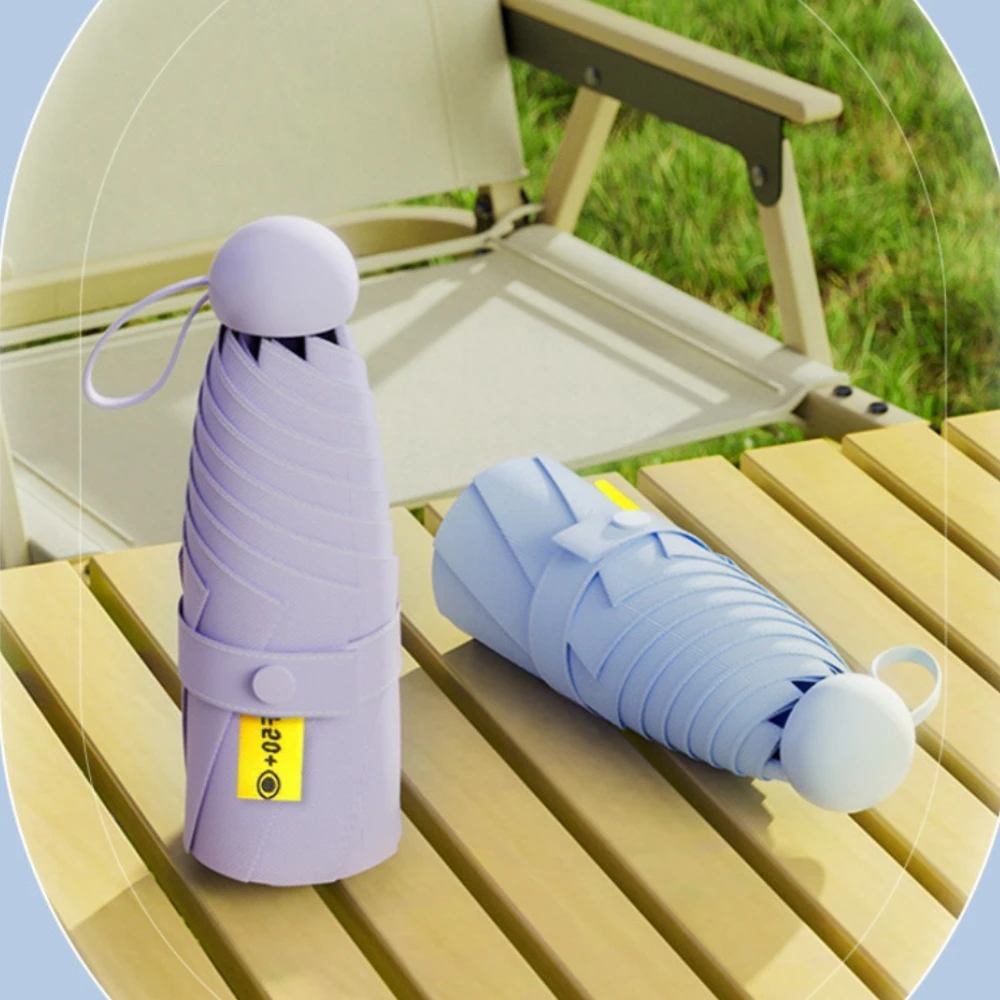 Kapselschirm, tragbar, UV-beständig, wasserdicht, kleines Haushaltsschirm, schwarzer Gummi-isolierter Regenschirm mit hoher Dichte Image