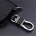 Portachiavi in metallo per auto creativo Portachiavi con fibbia in pelle Portachiavi con testa Portachiavi da uomo Adesivo con ciondolo in vita Fibbia con gancio in pelle Piccolo regalo