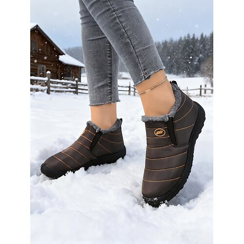 orangefarbene, wasserdichte Schneestiefel für Damen mit warmem Plüschfutter, leichte Winterschuhe zum Hineinschlüpfen für kaltes Wetter im Freien und im Halloween-Stil Image