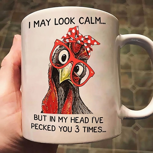 Lustige Geschenktasse: „Ich sehe vielleicht ruhig aus, aber innerlich habe ich dich dreimal geküsst." Kaffeetasse mit humorvollem Spruch – perfekt für Freunde, Familie oder als Bürogeschenk. Image