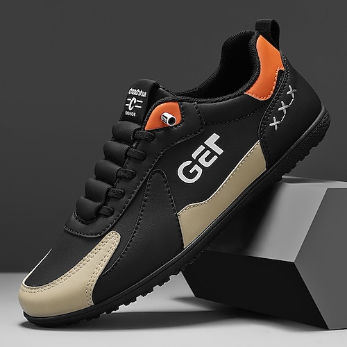 Schwarze und beige Golf-Sneaker für Herren, sportlich und bequem, ideal für Golfplätze und aktive Freizeitaktivitäten Image