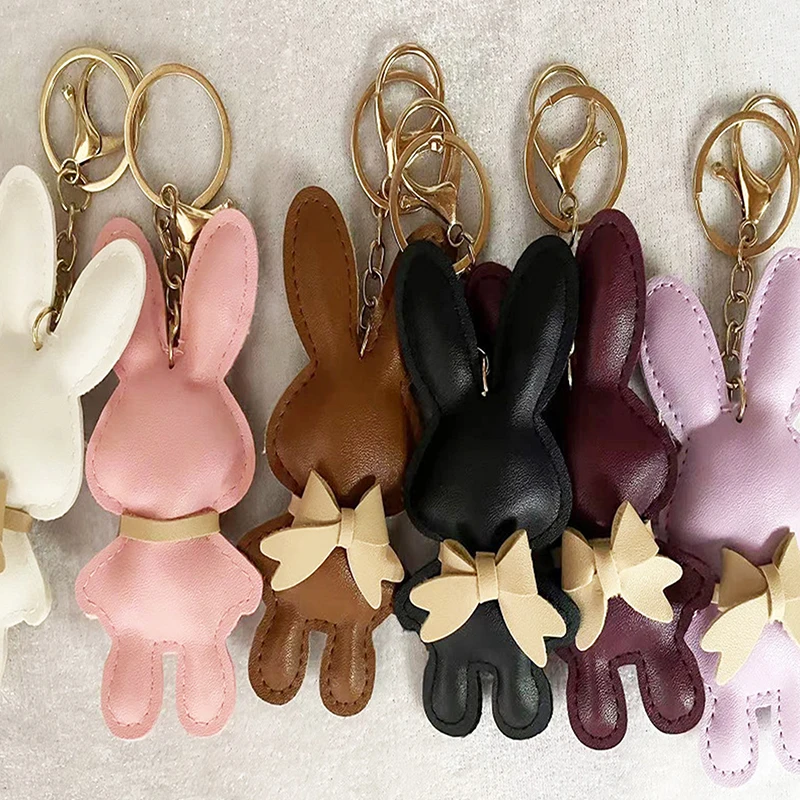 Bestseller 1 Stück Niedlicher PU-Leder Einfarbiger Hasen-Schlüsselanhänger Kreativer Schleifenhasen-Schlüsselring Auto-Schlüsselhalter Anhänger Taschencharme Geschenke Image