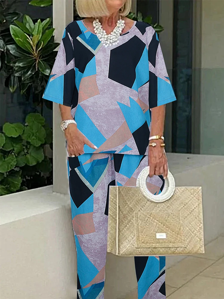 Set di pantaloni estivi in cotone e lino da donna taglie forti con girocollo stampato, top e pantaloni con maniche a cinque punti, completo in due pezzi