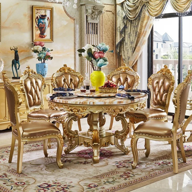 Europäischer Marmor-Esstisch mit runder Luxus-Esstisch- und Stuhlkombination aus Massivholz in Aristokraten-Gold für 6/8 Personen. Image