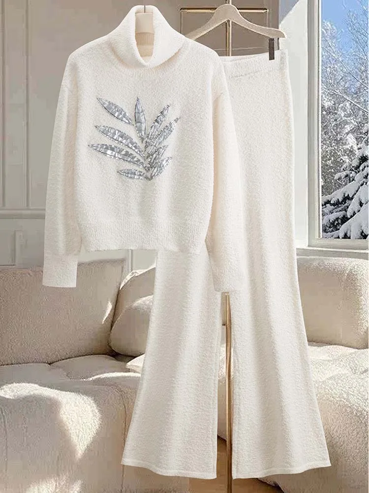 Completo da donna in lana con ricamo sul risvolto, elegante e casual, composto da top a maniche lunghe e pantaloni in lana, stile rilassato e casual.
