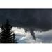 Dramatic funnel cloud created in dark storm clouds with silhouetted evergreen trees; Calgary Alberta Canada Poster Print (38 x 24)