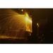Buyenlarge 'Welder's torch has sparks fly on Locomotive factory Floor' Photographic Print in Black | 28 H x 42 W x 1.5 D in | Wayfair