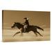 East Urban Home Oregon 'Cowgirl on Horse Running Through Field' - Photograph Print on Canvas in White | 24 H x 36 W x 1.5 D in | Wayfair