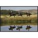 East Urban Home 'Cowboys Riding Horses w/ Dogs Running Beside Pond' Framed Photographic Print on Canvas in Green | 20 H x 30 W x 1.5 D in | Wayfair