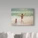 Trademark Fine Art 'Boy & Dog, Lifeguard' Oil Painting Print on Wrapped Canvas in Green | 18 H x 24 W x 2 D in | Wayfair BL01806-C1824GG