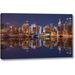 Ebern Designs 'Illuminated Manhattan skyline at twilight - New York City' by Assaf Frank Giclee Art Print on Wrapped Canvas in Indigo | Wayfair