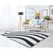White 22 x 1.2 in Area Rug - Wrought Studio™ Fitts Abstract Shag Jet Black/Pure Area Rug Polyester | 22 W x 1.2 D in | Wayfair